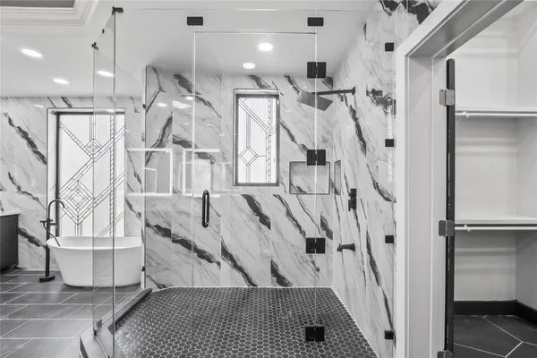 a hallway with cabinets and window