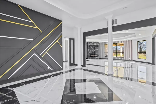 a large white kitchen with a large window