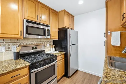 a kitchen with a stove microwave and refrigerator
