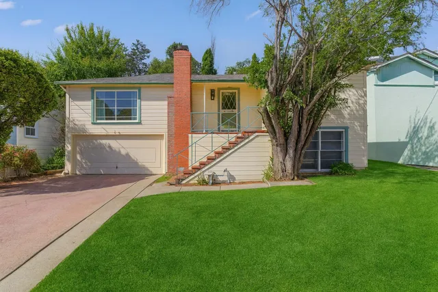 a front view of house with yard