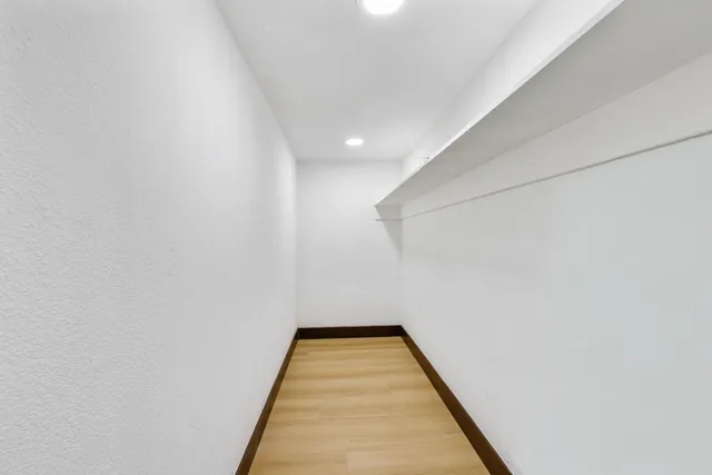 a bathroom with a sink a bathtub and a mirror