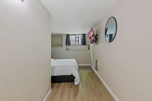 a bedroom with a bed and a cabinets