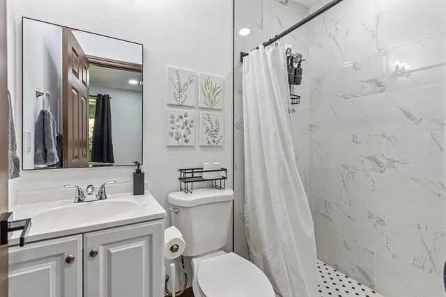 a bedroom with a large bed and a large window