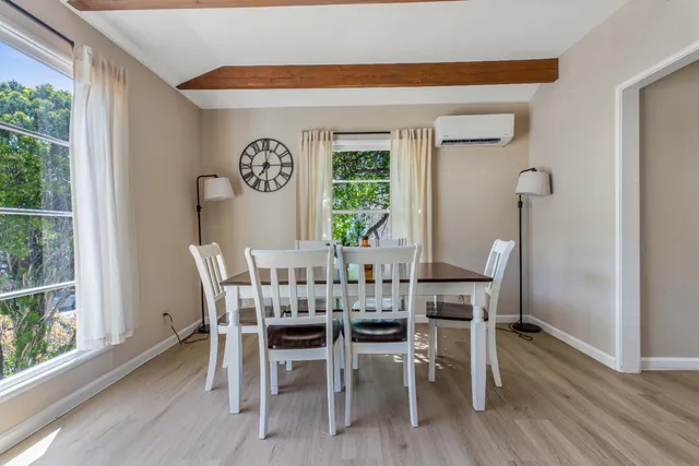 a view of a room with furniture and window