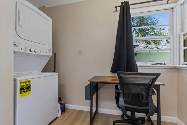 a kitchen with white cabinets appliances and sink