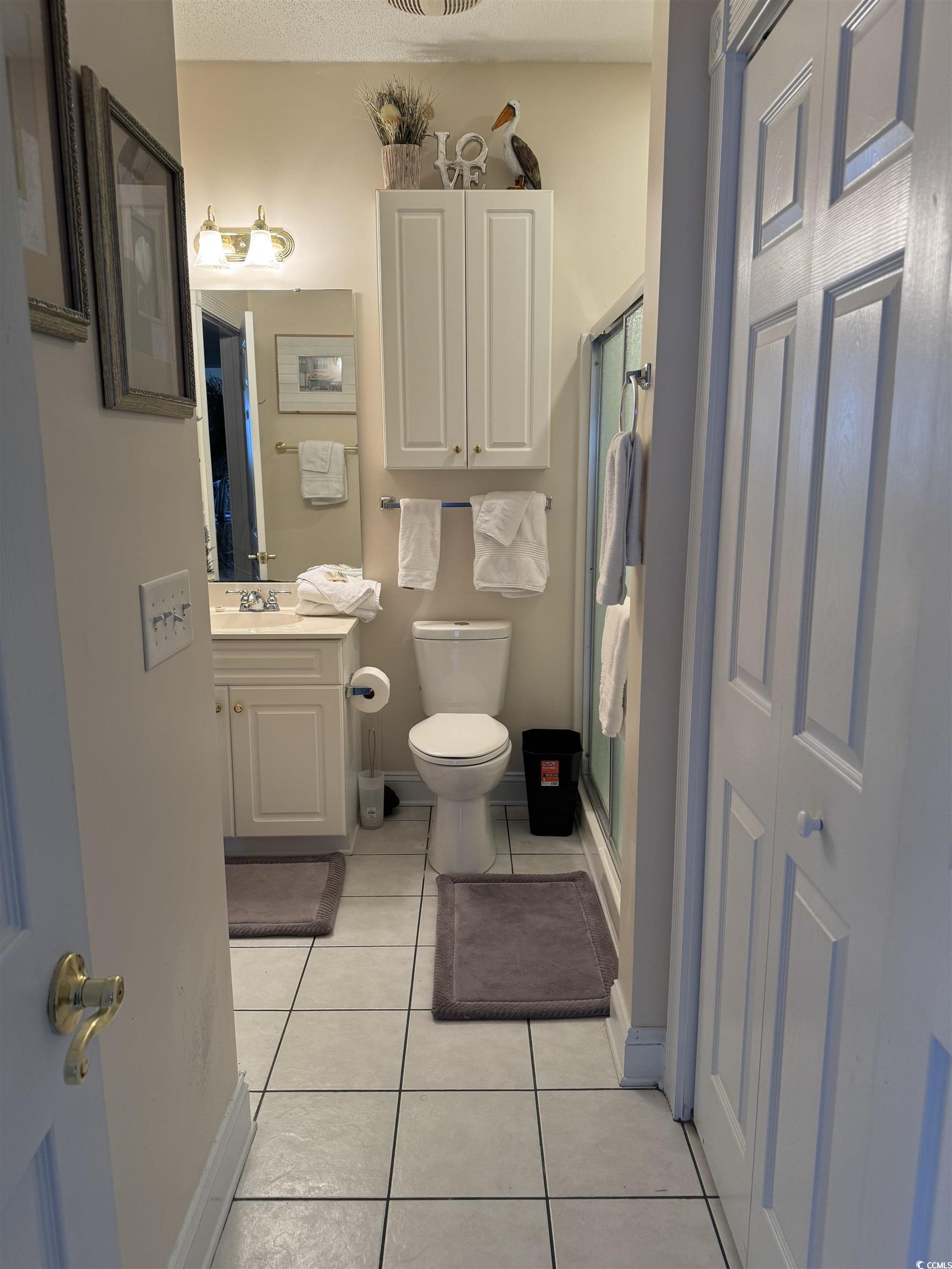 1538 Lanterns Rest Road, Unit 303 Myrtle Beach, SC 29579 - Photo 11 of 23 Bathroom featuring vanity, a shower with shower do