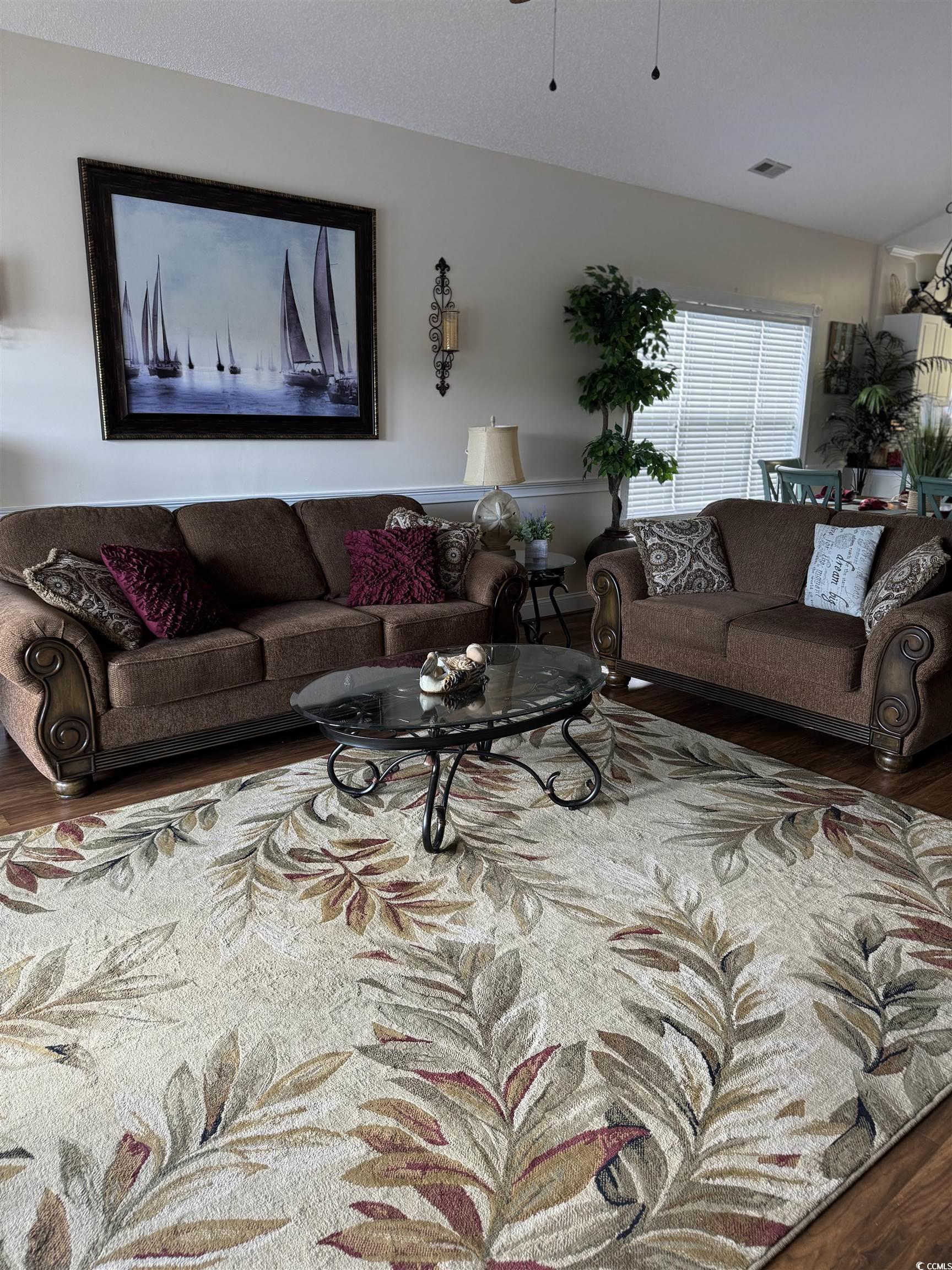 1538 Lanterns Rest Road, Unit 303 Myrtle Beach, SC 29579 - Photo 12 of 23 Living room featuring hardwood / wood-style floors