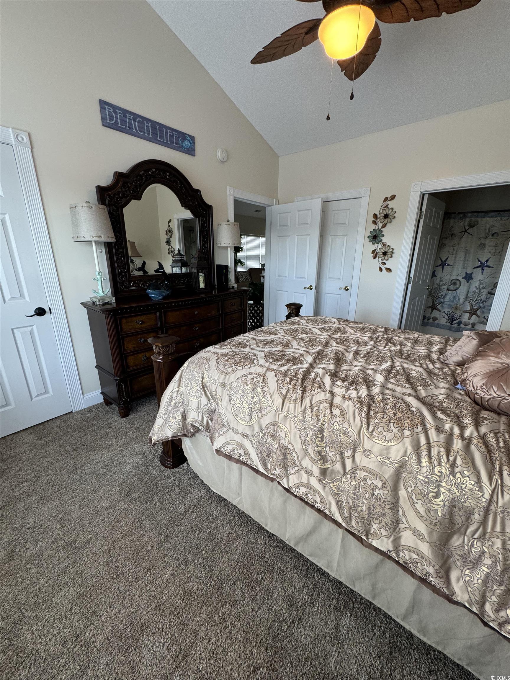 1538 Lanterns Rest Road, Unit 303 Myrtle Beach, SC 29579 - Photo 16 of 23 Bedroom with lofted ceiling, ceiling fan, and carp