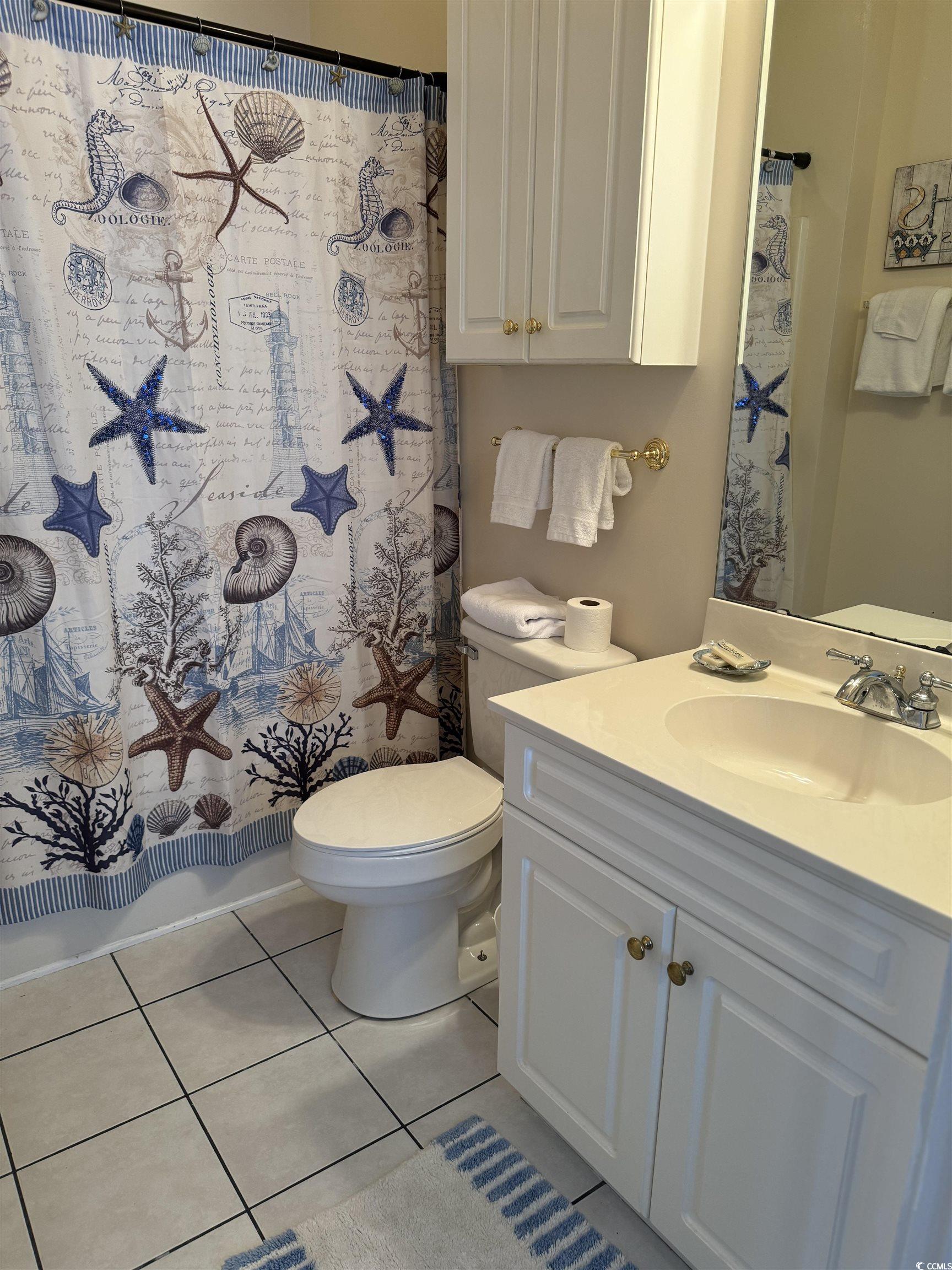 1538 Lanterns Rest Road, Unit 303 Myrtle Beach, SC 29579 - Photo 18 of 23 Full bathroom featuring tile patterned floors, toi
