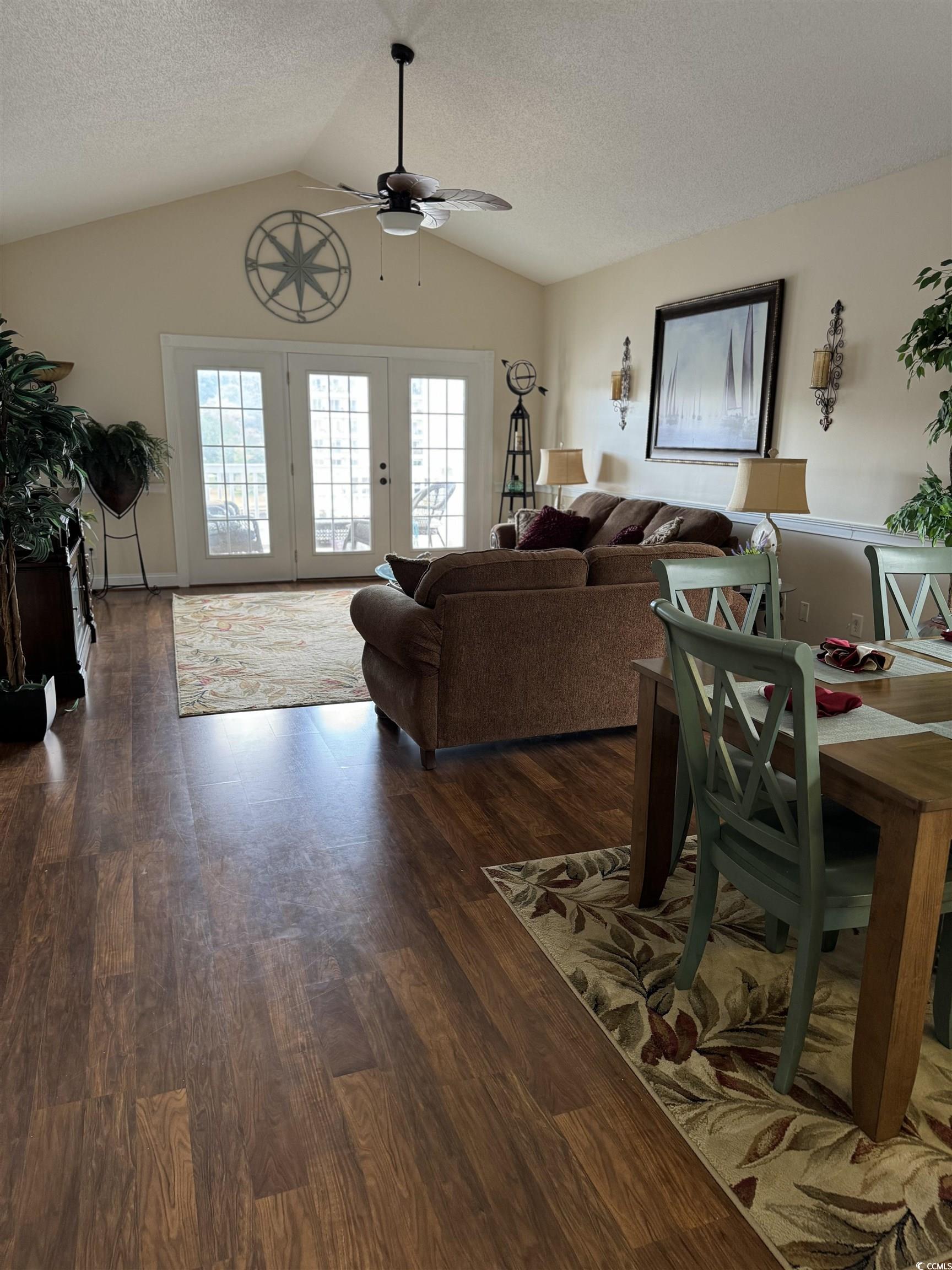 1538 Lanterns Rest Road, Unit 303 Myrtle Beach, SC 29579 - Photo 5 of 23 Living room with vaulted ceiling, dark hardwood /