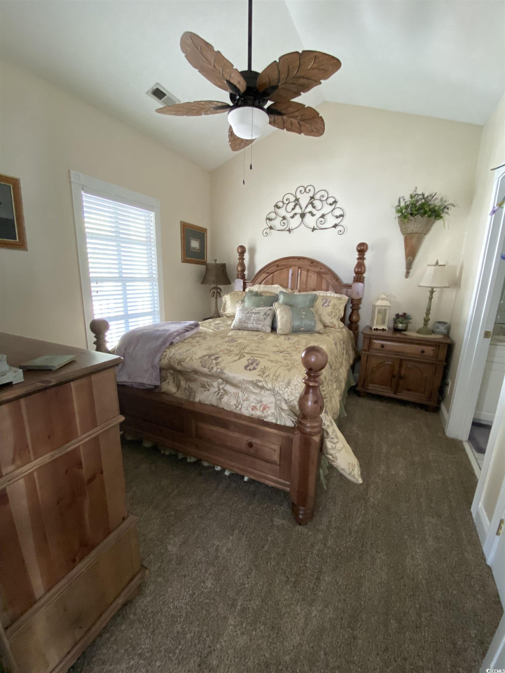 1538 Lanterns Rest Road, Unit 303 Myrtle Beach, SC 29579 - Photo 8 of 23 Carpeted bedroom featuring lofted ceiling and ceil