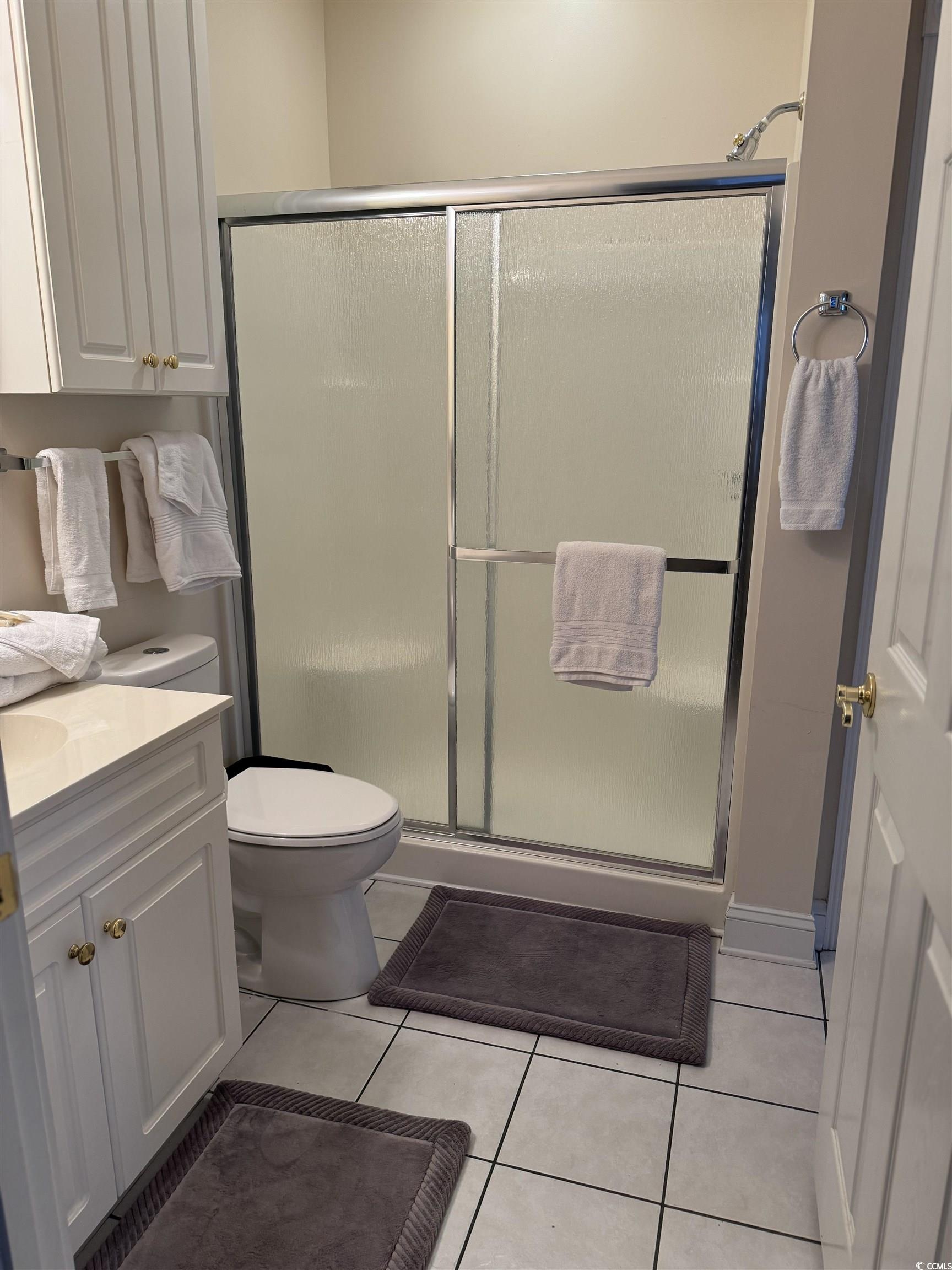 1538 Lanterns Rest Road, Unit 303 Myrtle Beach, SC 29579 - Photo 10 of 23 Bathroom with tile patterned flooring, a shower wi