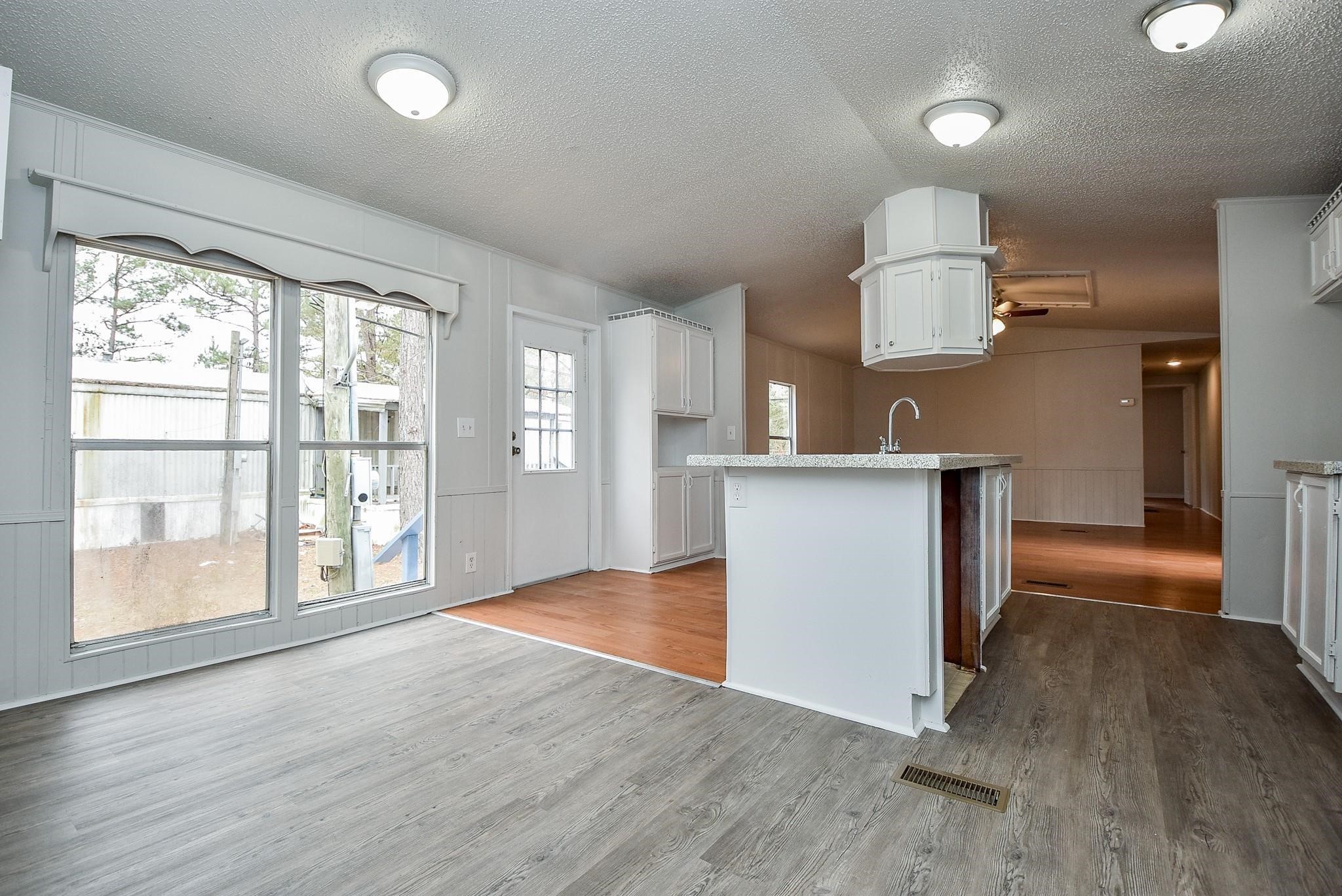 12842 Roy Harris Loop Conroe, TX 77306 - Photo 20 of 36 a view of a kitchen with a sink and a window