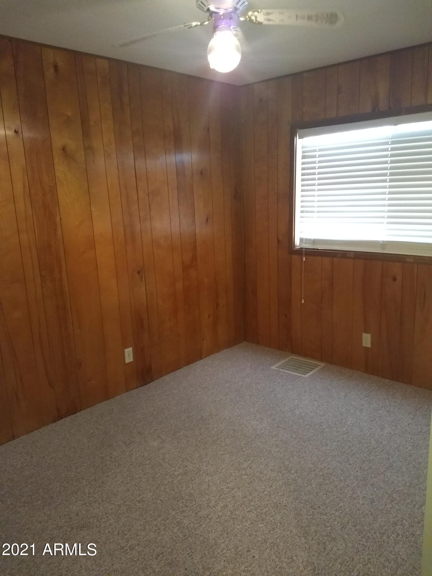 590 North Cactus Road Apache Junction, AZ 85119 - Photo 11 of 34 a view of an empty room with a window