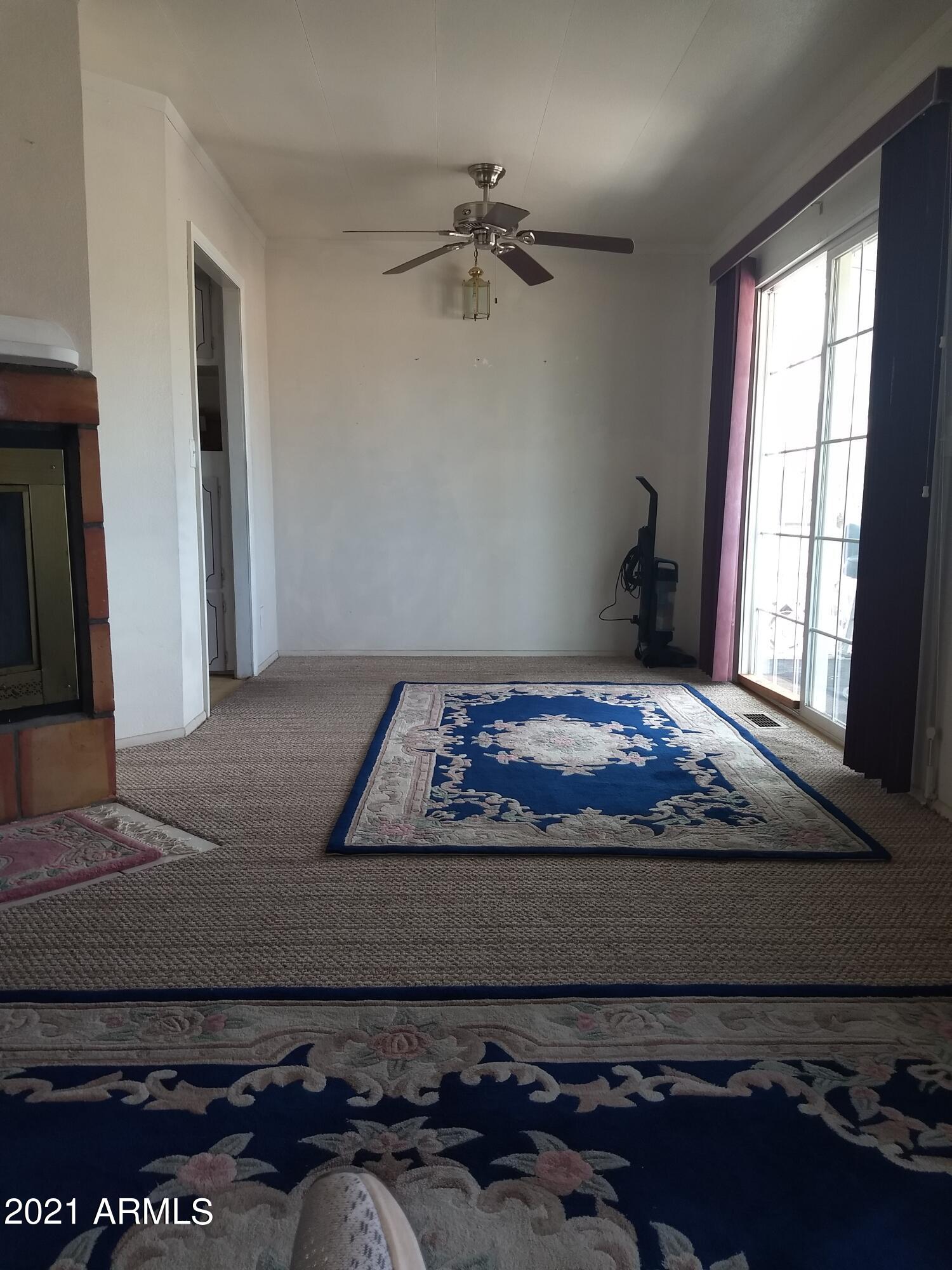 590 North Cactus Road Apache Junction, AZ 85119 - Photo 17 of 34 a bed sitting in a bedroom next to a window