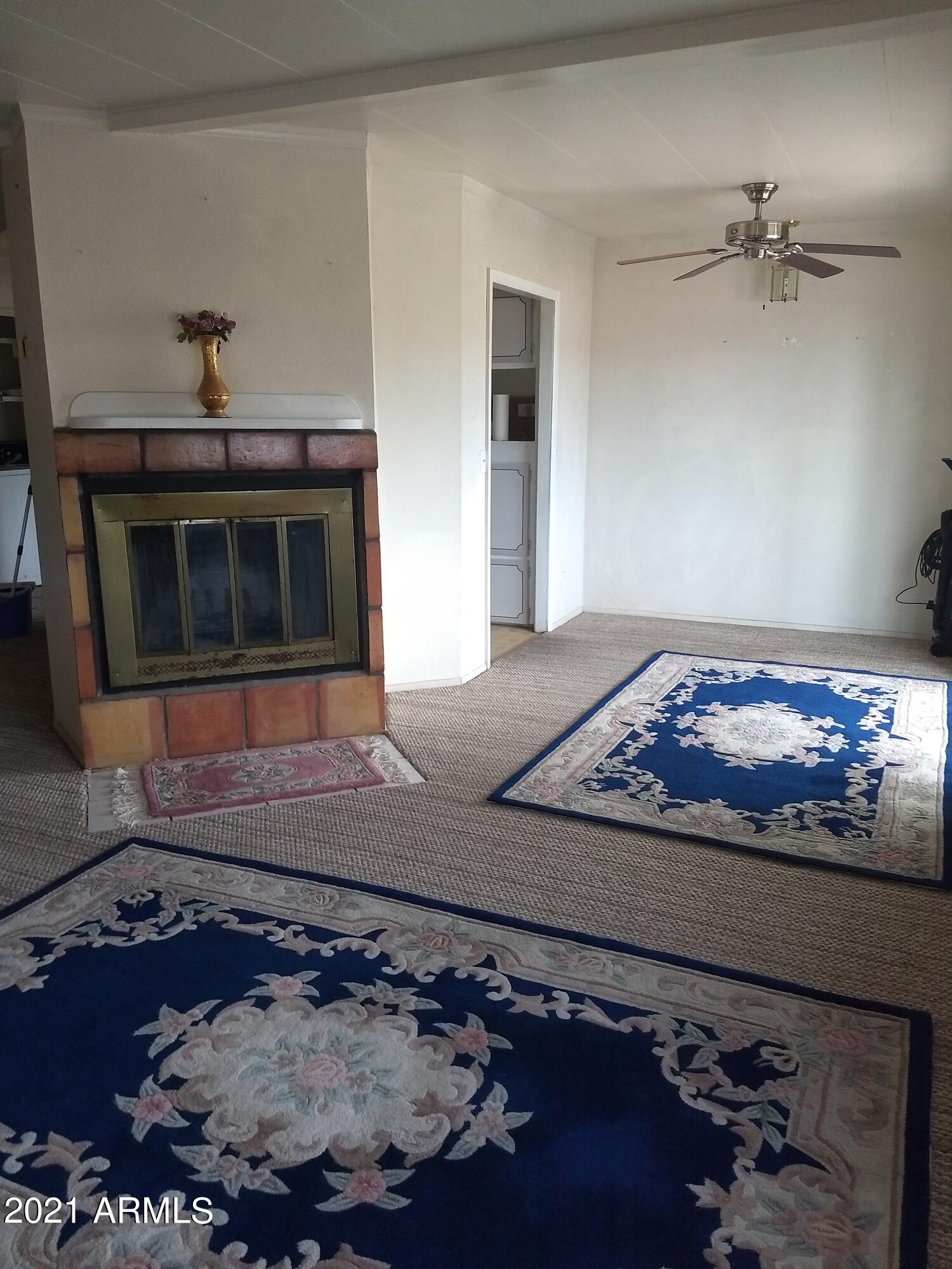 590 North Cactus Road Apache Junction, AZ 85119 - Photo 19 of 34 a living room with a rug