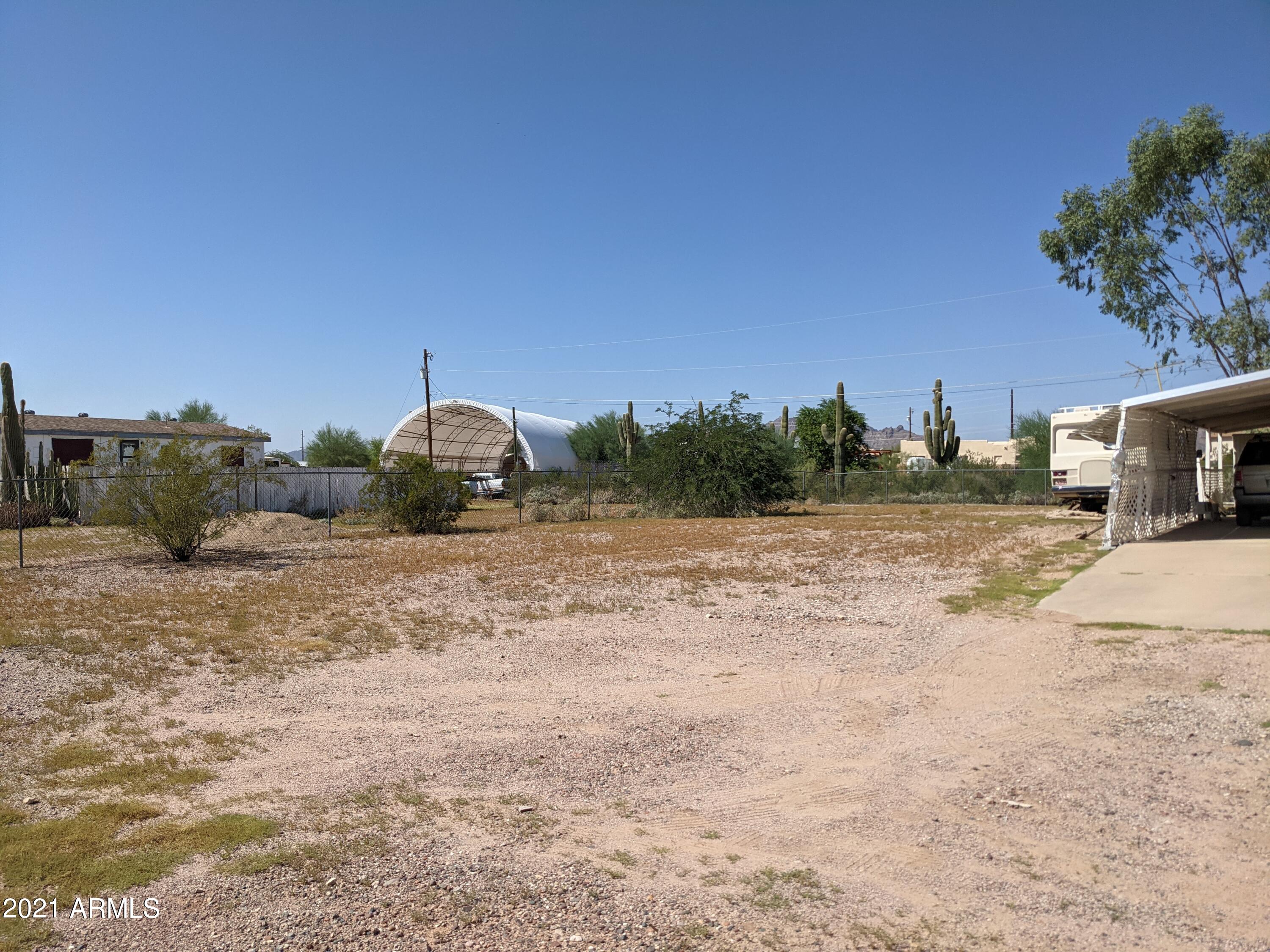 590 North Cactus Road Apache Junction, AZ 85119 - Photo 5 of 34 a view of a dry yard with wooden fence