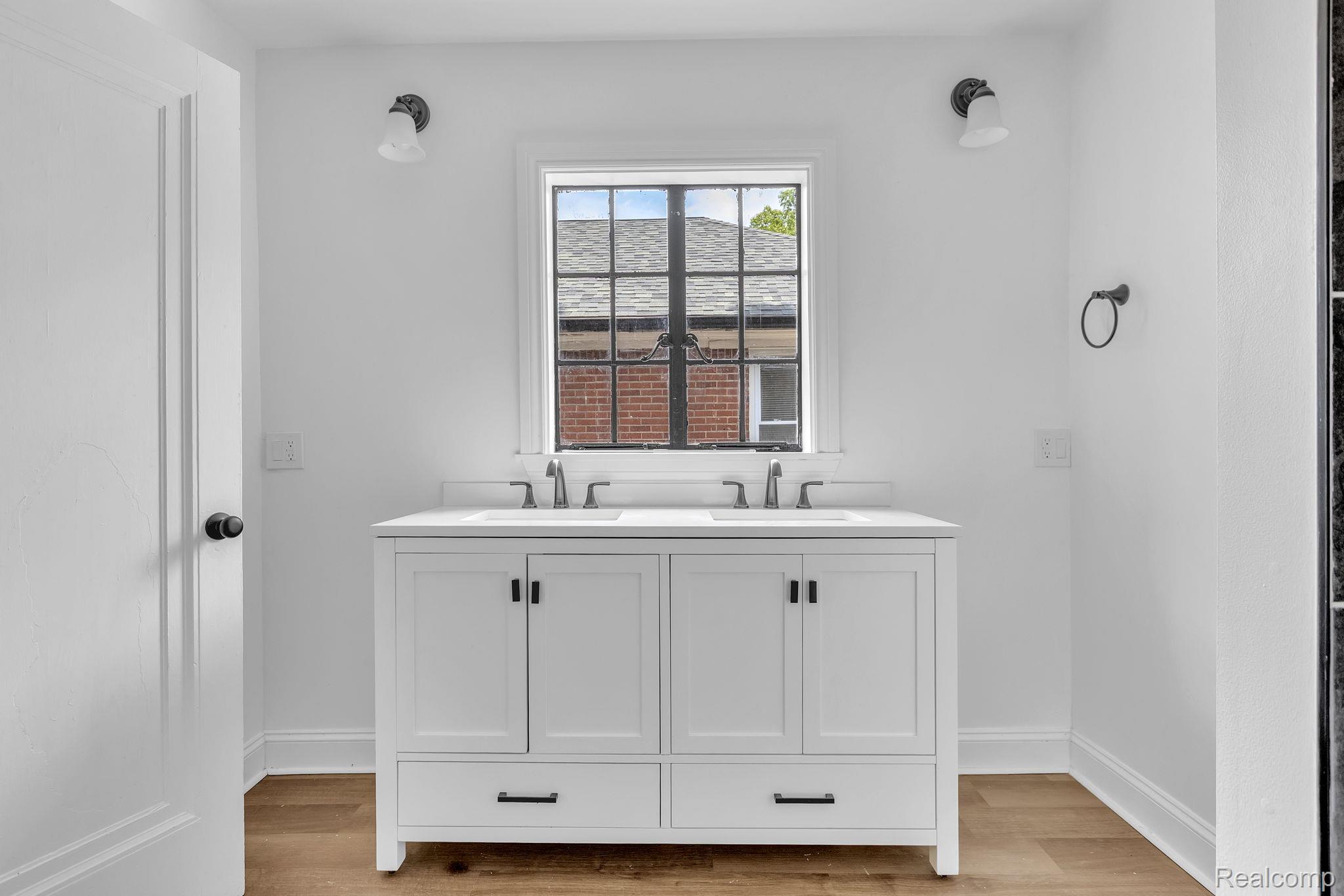 19510 Stratford Road Detroit, MI 48221 - Photo 30 of 45 White double vanity with quartz countertop and two undermount sinks