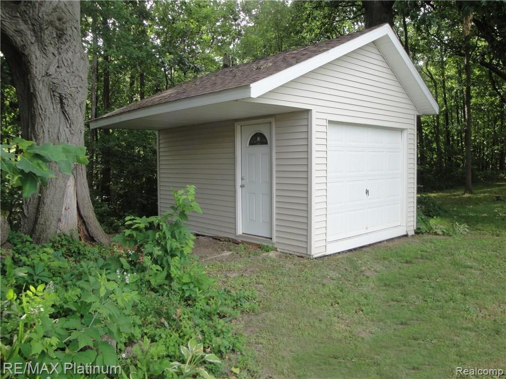 1201 Oakcrest Road Howell, MI 48843 - Photo 54 of 57 16 x 14 Shed with 4' overhang. Nice place to keep your outdoor stuff.