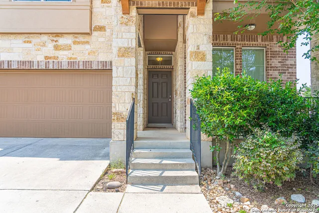 a front view of a house with a glass door
