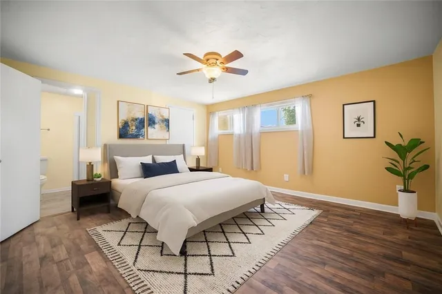 a view of a big room with wooden floor and windows in a room