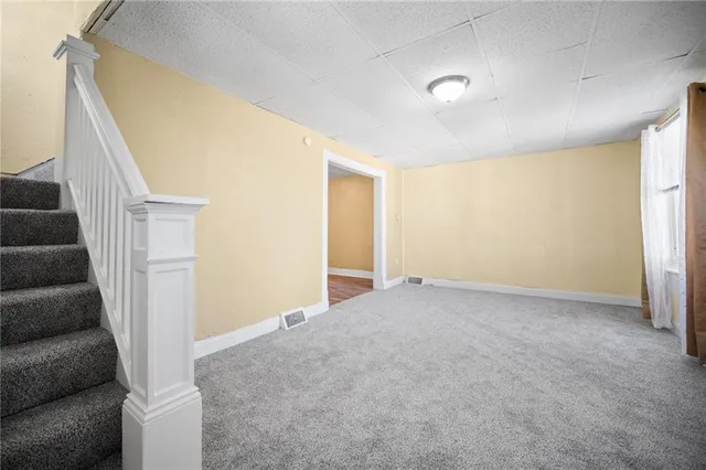 a view of an empty room with a window