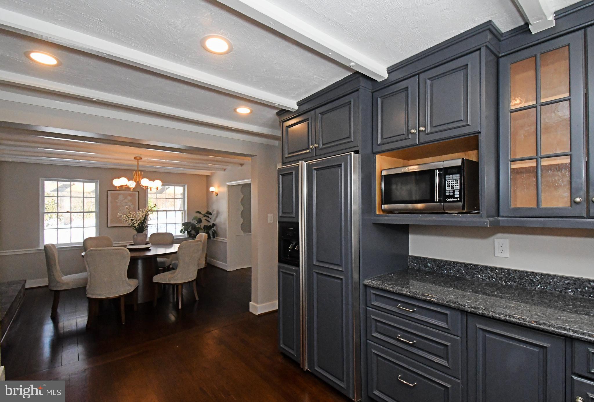 457 School House Lane Devon, PA 19333 - Photo 17 of 93 a kitchen with stainless steel appliances granite countertop a refrigerator stove microwave and cabinets