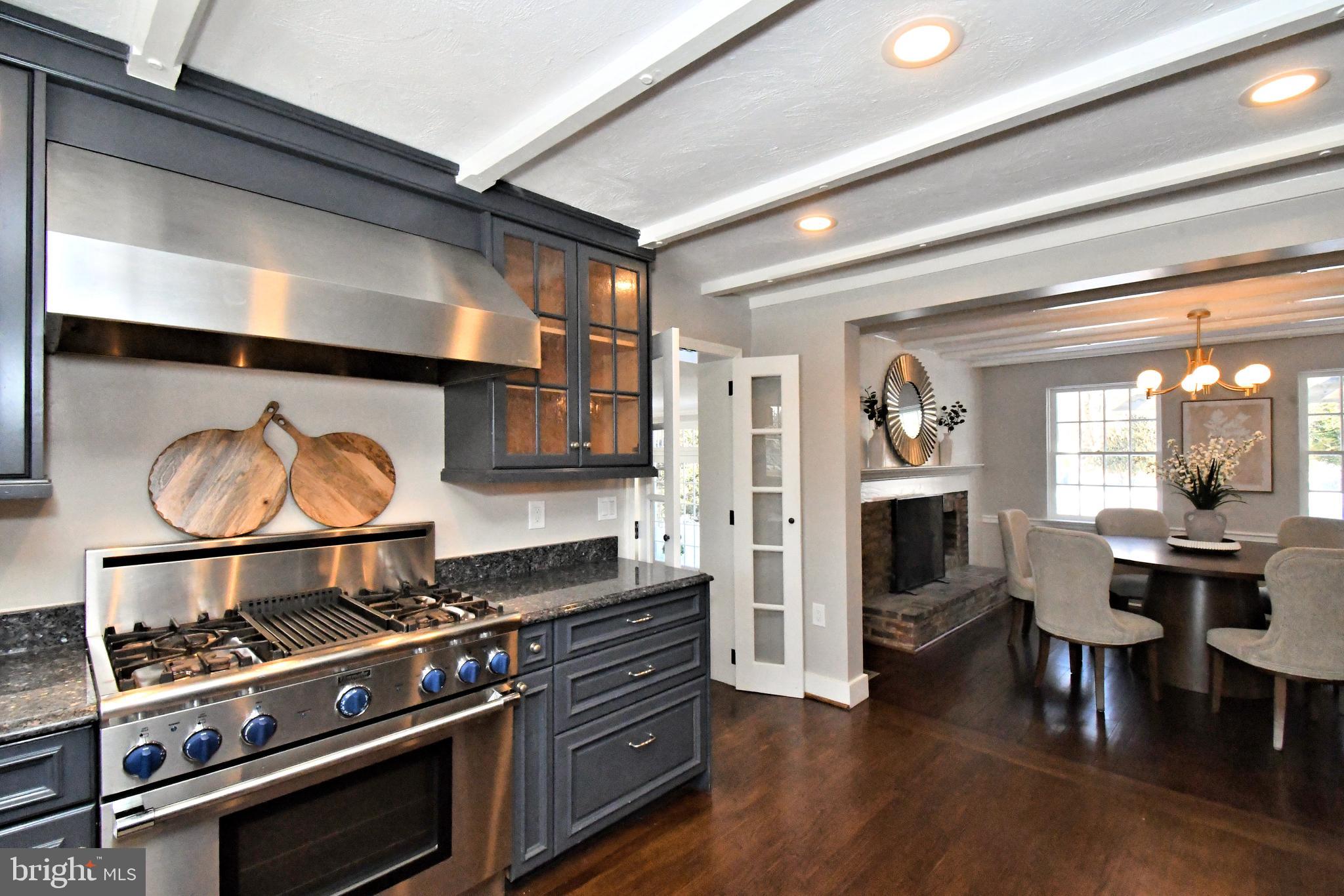 457 School House Lane Devon, PA 19333 - Photo 21 of 93 a kitchen with stainless steel appliances granite countertop a stove and a wooden floors