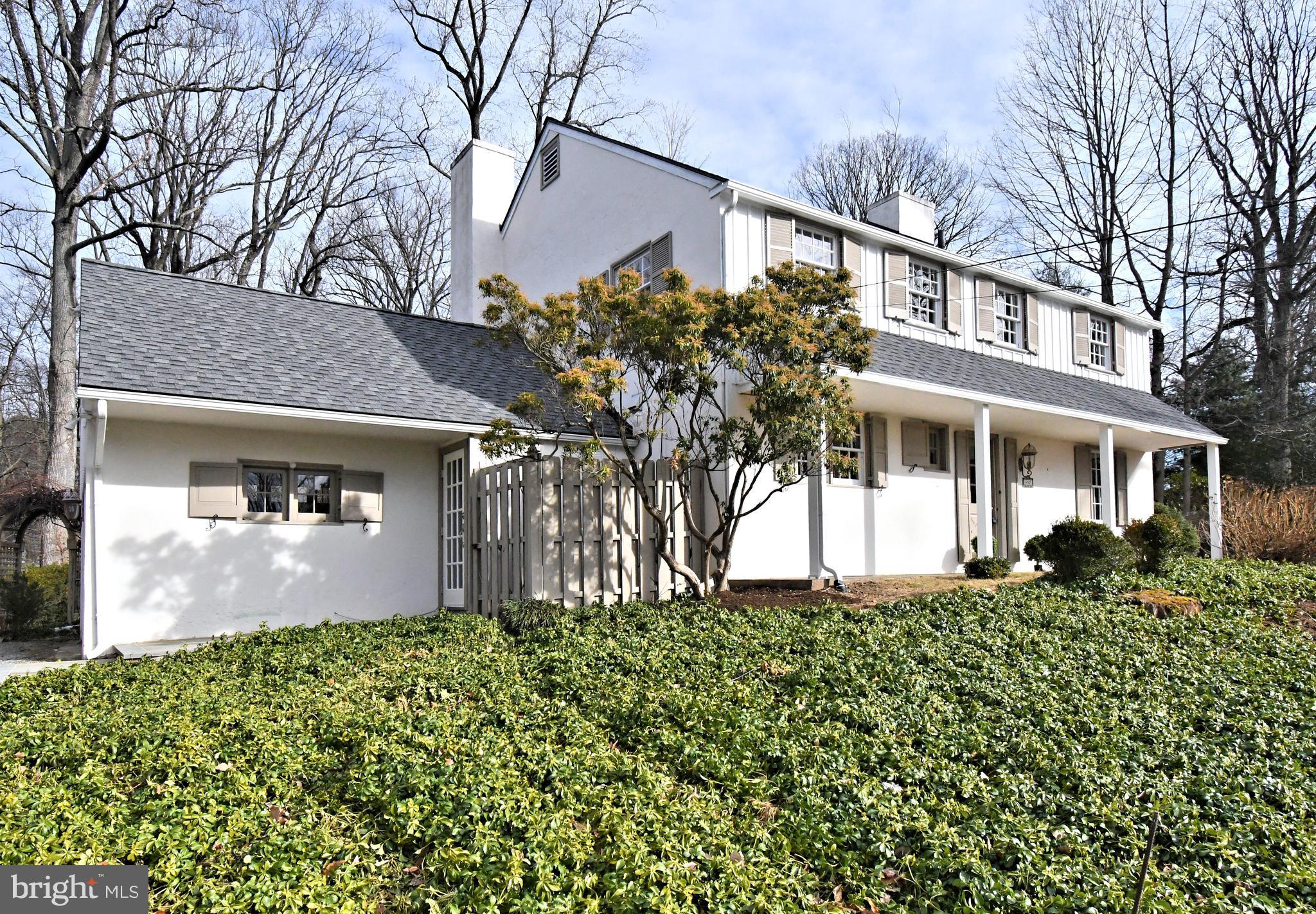 457 School House Lane Devon, PA 19333 - Photo 3 of 93 a front view of a house with a garden
