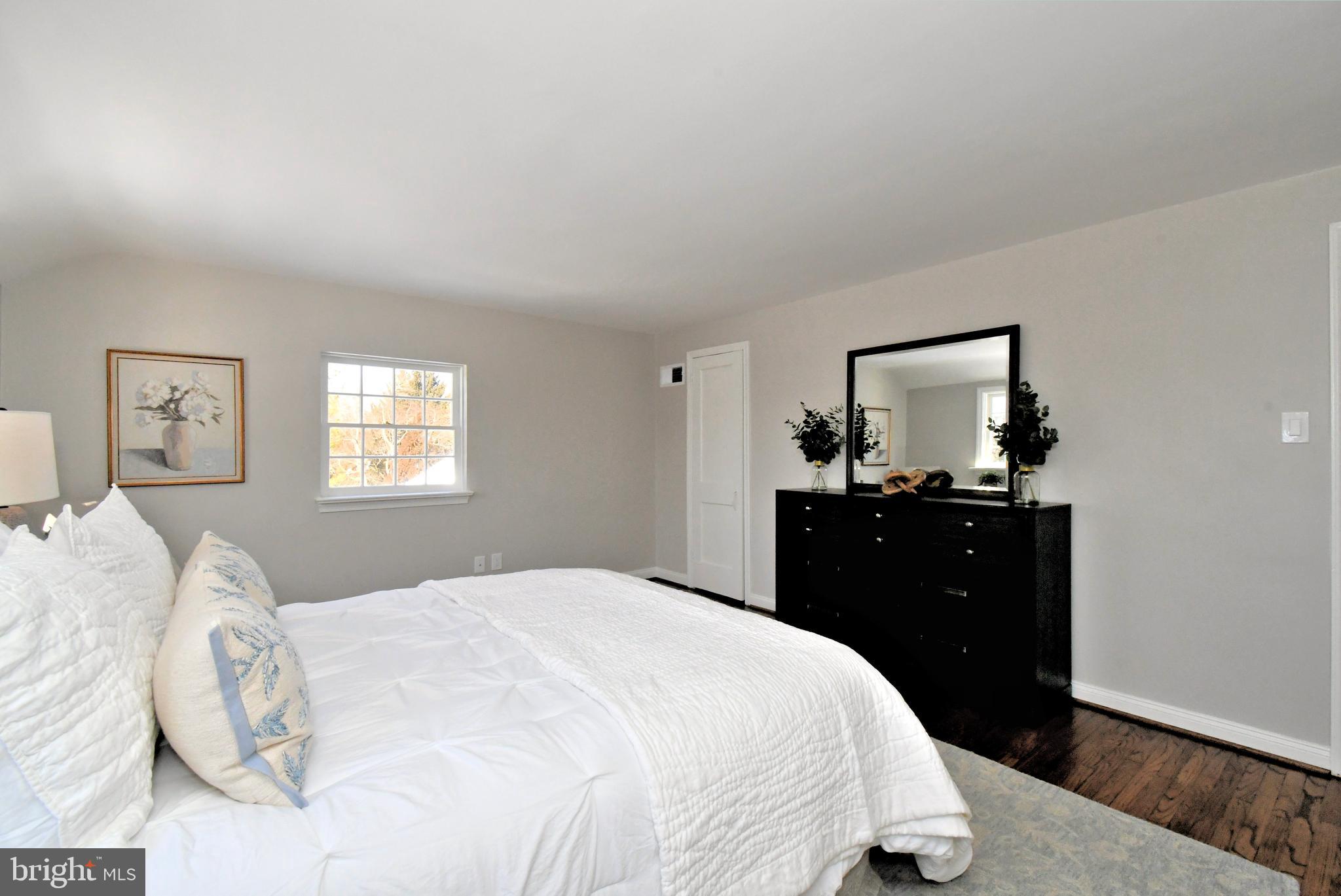 457 School House Lane Devon, PA 19333 - Photo 41 of 93 a bedroom with a bed and a mirror