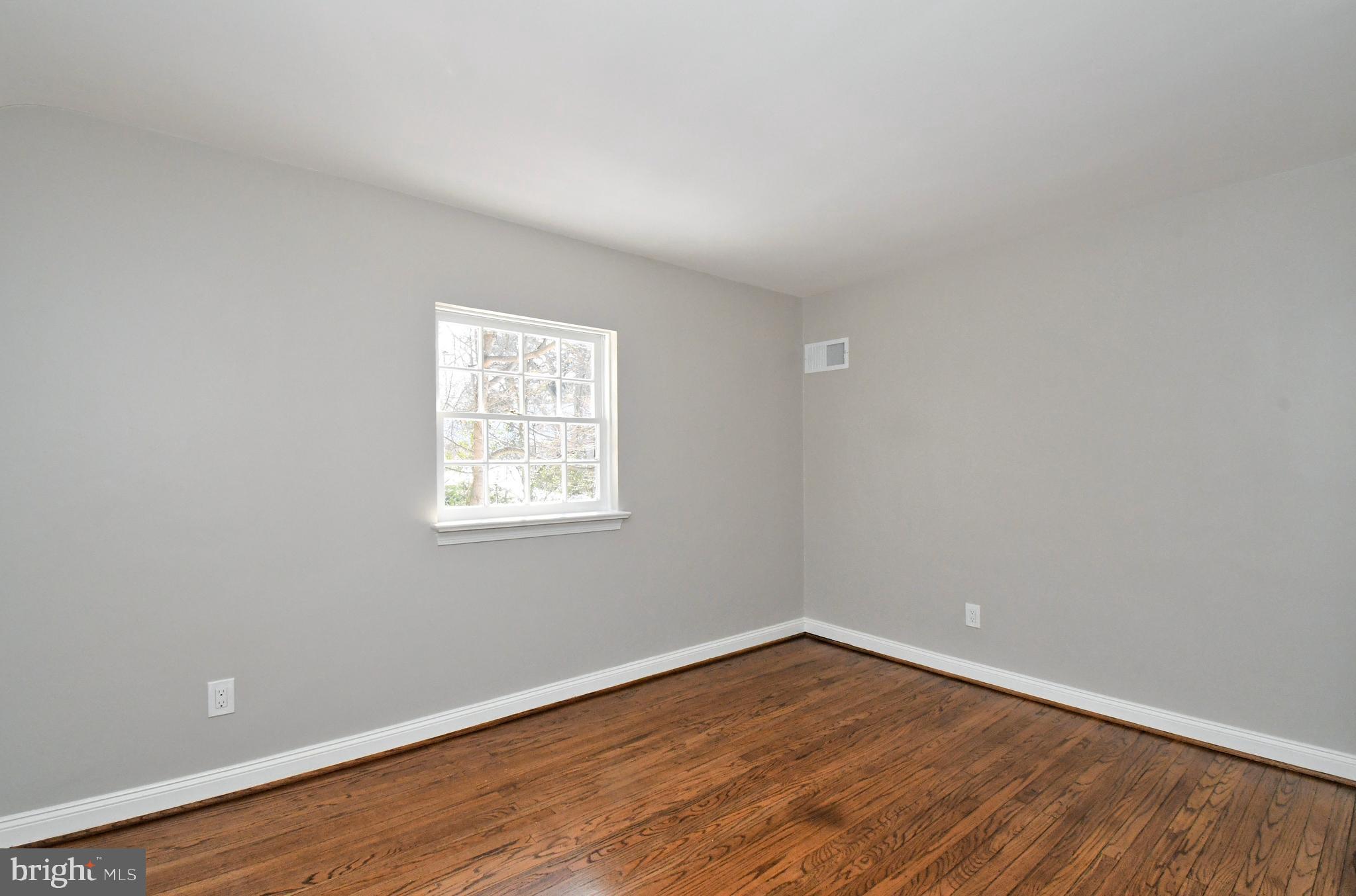457 School House Lane Devon, PA 19333 - Photo 57 of 93 wooden floor in an empty room with a window