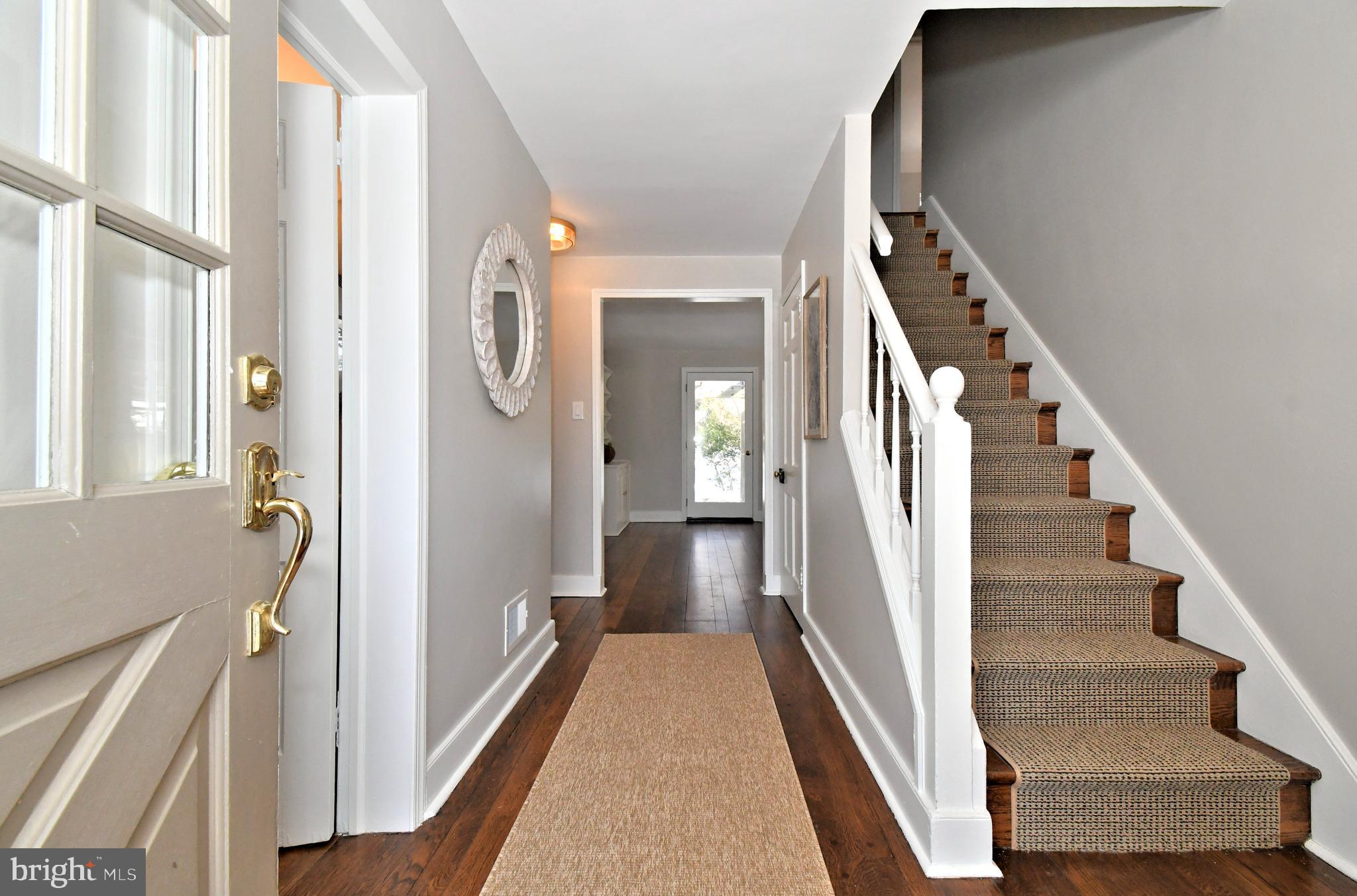 457 School House Lane Devon, PA 19333 - Photo 6 of 93 a view of a hallway with wooden floor and staircase
