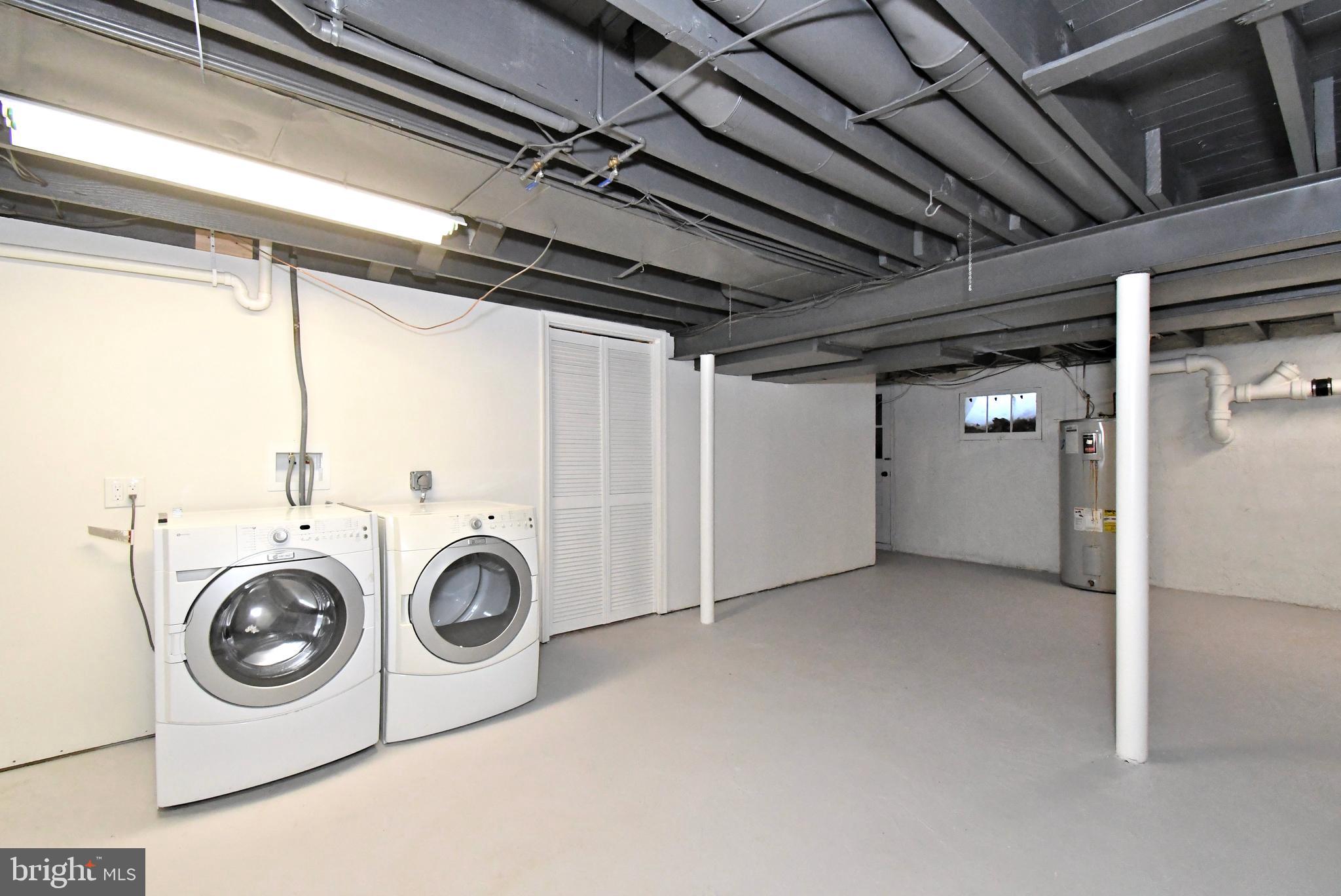 457 School House Lane Devon, PA 19333 - Photo 62 of 93 a utility room with dryer and washer