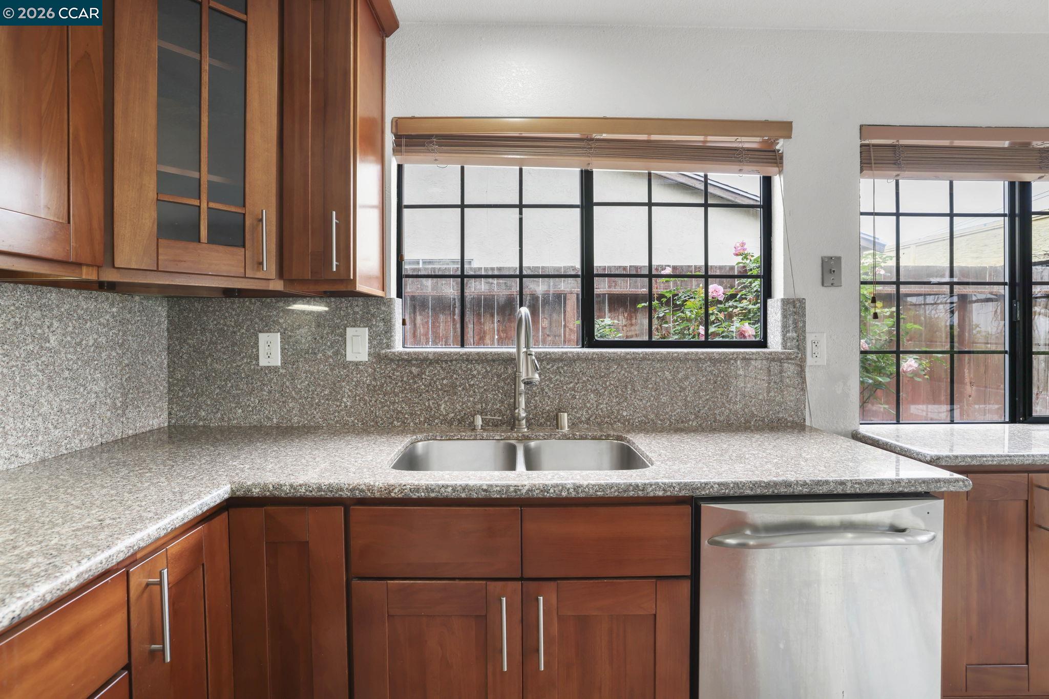 3438 Gregory Drive Bay Point, CA 94565 - Photo 11 of 24 a kitchen with granite countertop a sink and a window