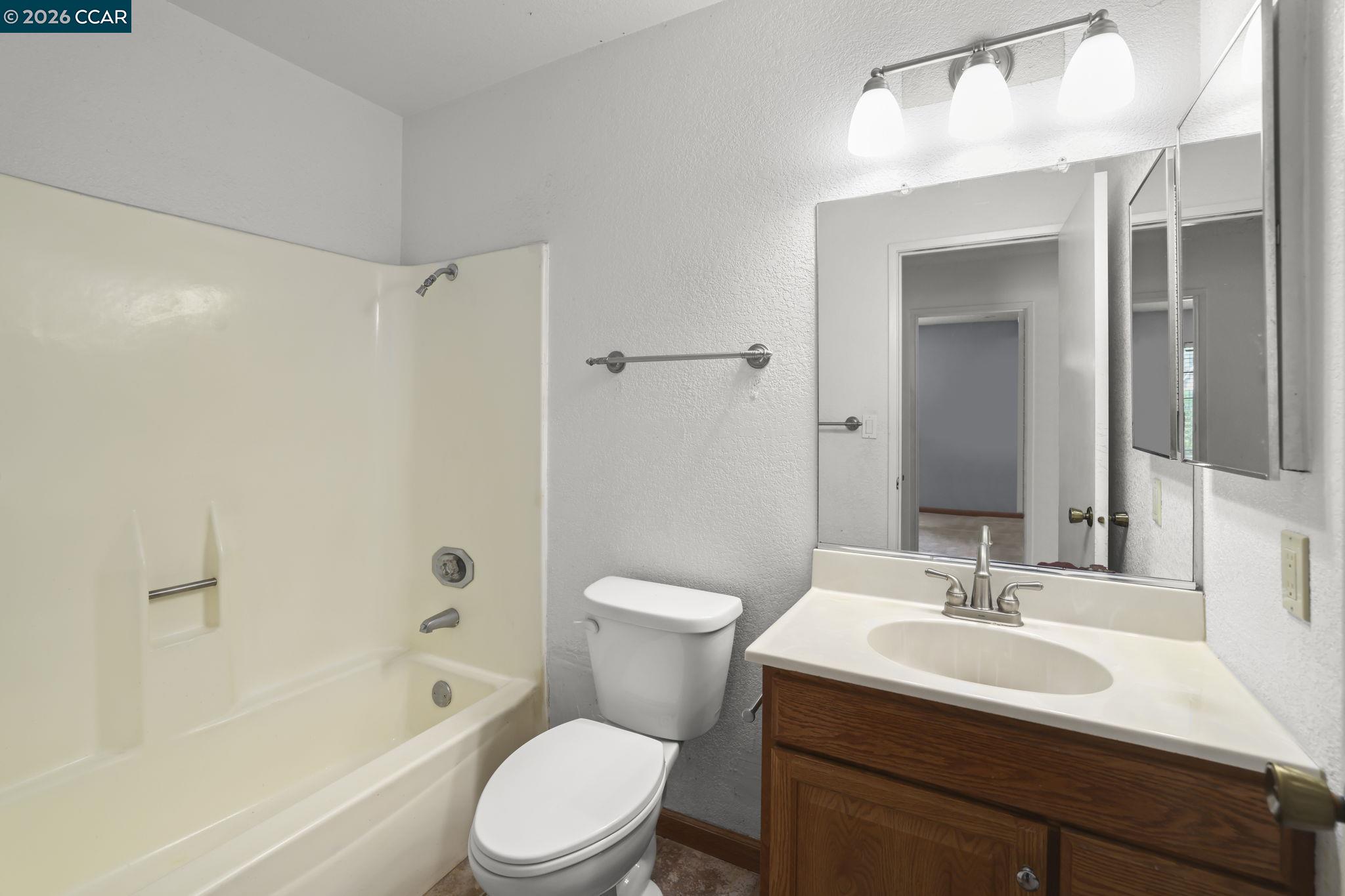 3438 Gregory Drive Bay Point, CA 94565 - Photo 14 of 24 a bathroom with a sink toilet and shower
