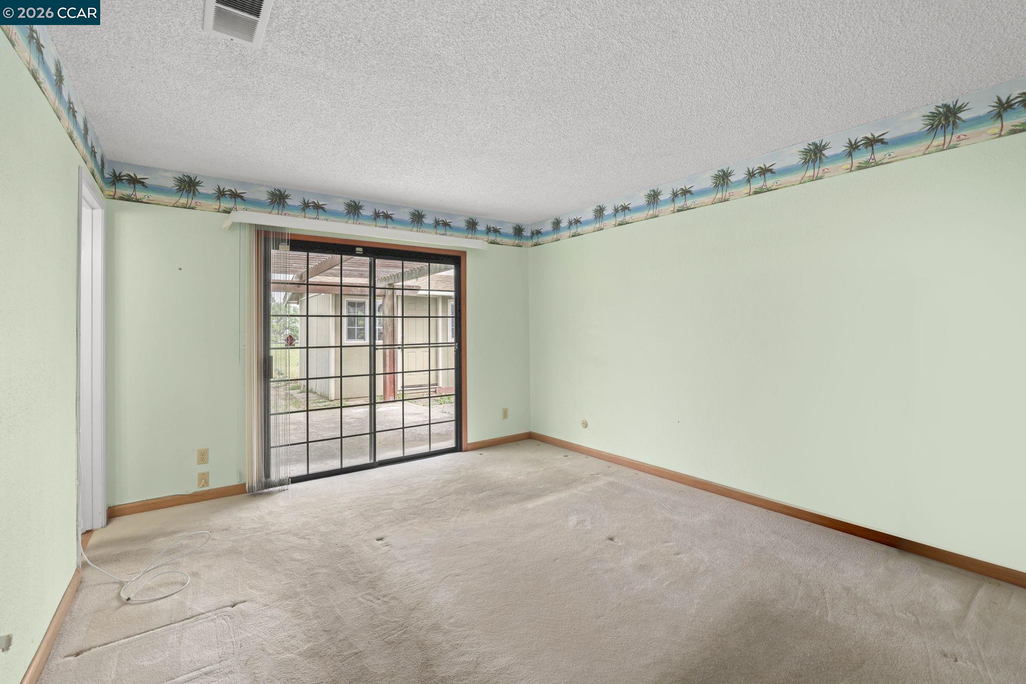 3438 Gregory Drive Bay Point, CA 94565 - Photo 17 of 24 a view of an empty room with a window