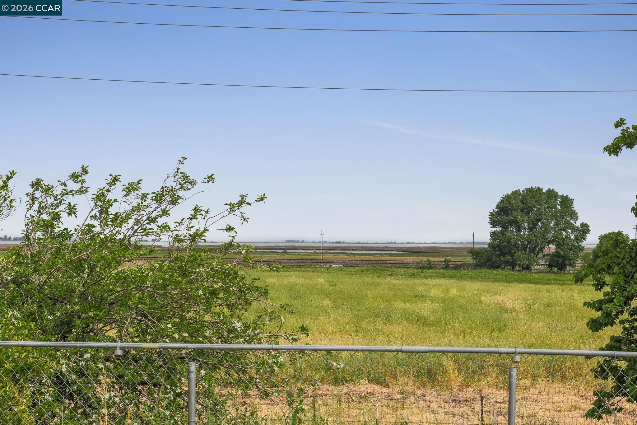 3438 Gregory Drive Bay Point, CA 94565 - Photo 23 of 24 a view of a room with a floor to ceiling window and potted plants