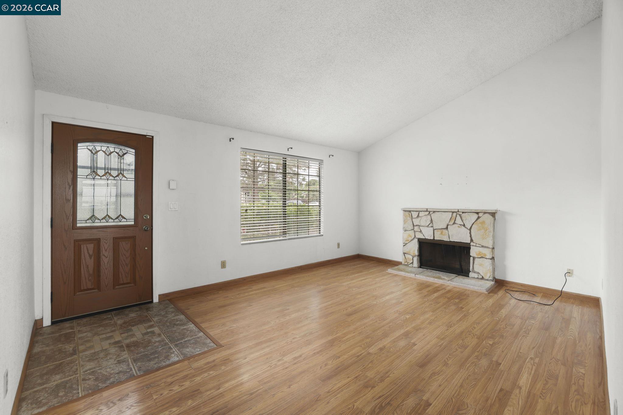 3438 Gregory Drive Bay Point, CA 94565 - Photo 5 of 24 an empty room with windows and fireplace