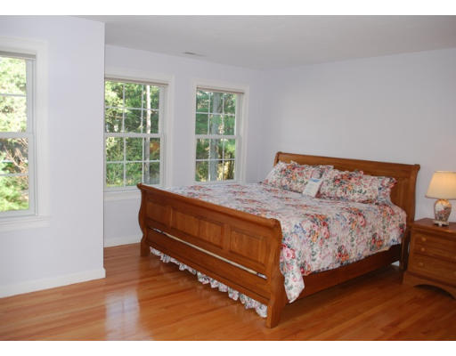 3 Marlboro Road Lexington, MA 02421 - Photo 13 of 18 a bed sitting in a bedroom next to a window