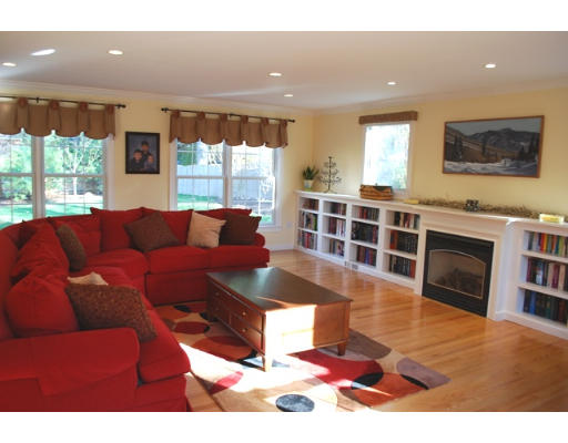 3 Marlboro Road Lexington, MA 02421 - Photo 3 of 18 a living room with furniture a flat screen tv and a floor to ceiling window