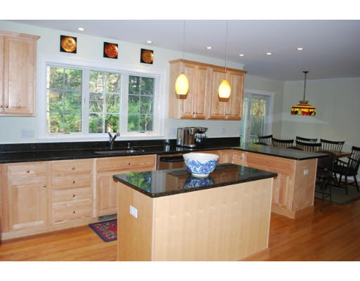 3 Marlboro Road Lexington, MA 02421 - Photo 6 of 18 a kitchen with kitchen island granite countertop a sink and a stove with wooden floor