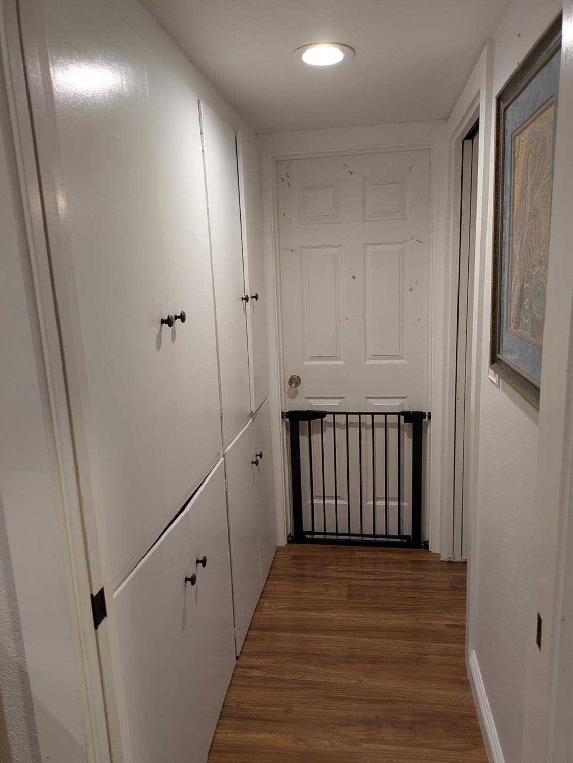 25931 Thornton Road Thornton, CA 95686 - Photo 14 of 31 a view of a hallway with wooden floor and staircase