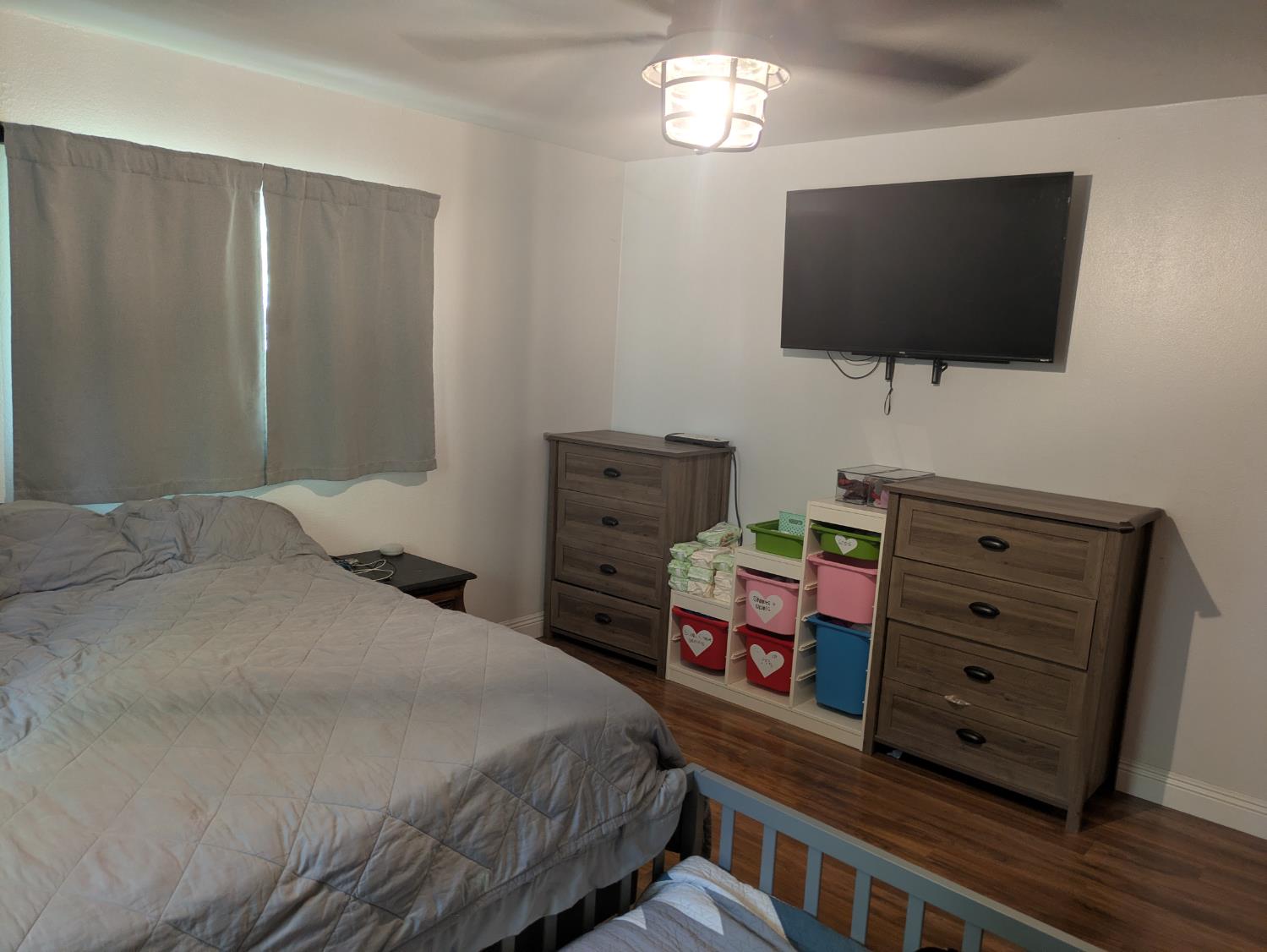 25931 Thornton Road Thornton, CA 95686 - Photo 16 of 31 a bedroom with a bed and flat screen tv