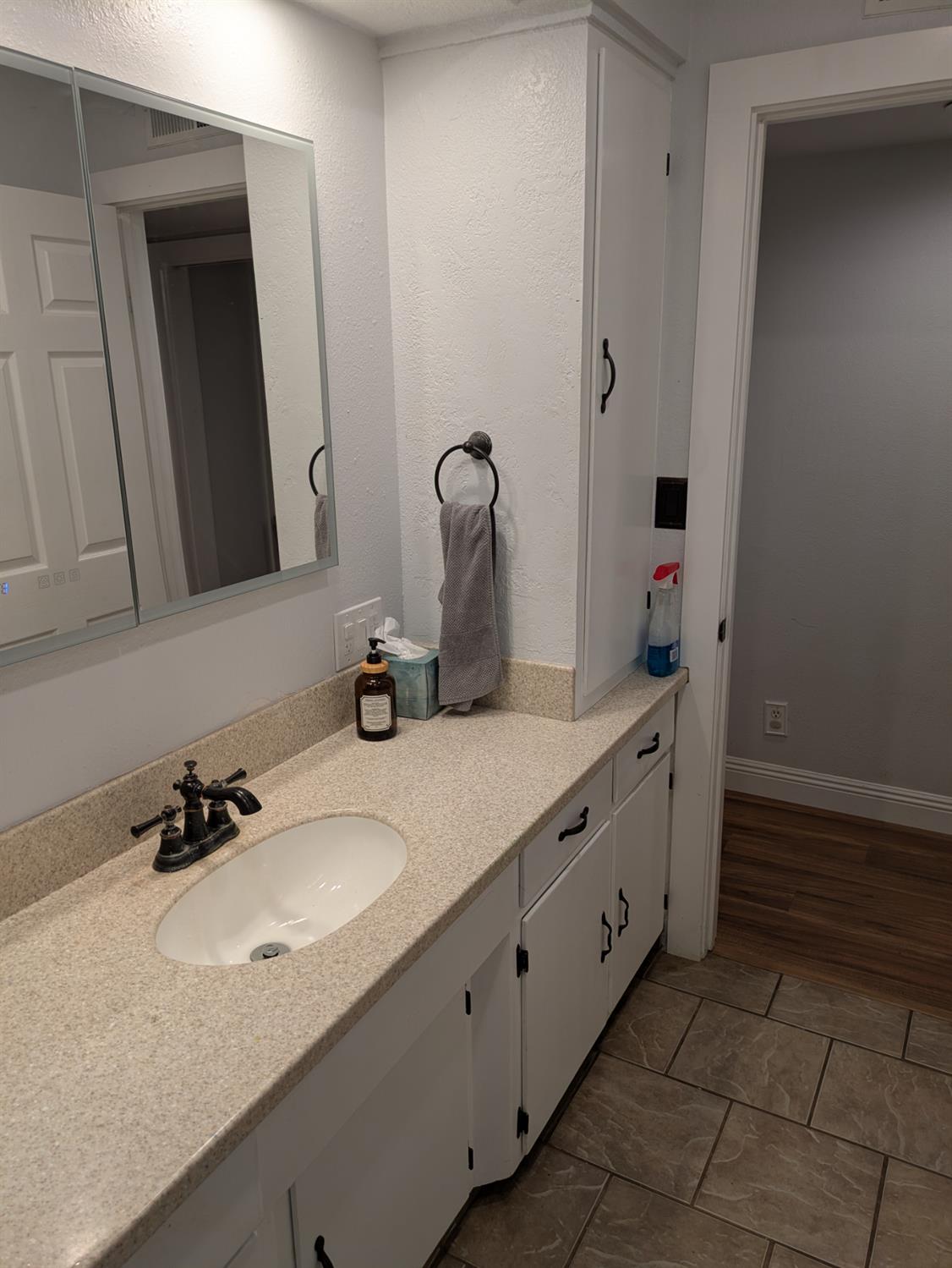 25931 Thornton Road Thornton, CA 95686 - Photo 18 of 31 a bathroom with a double vanity sink and a mirror
