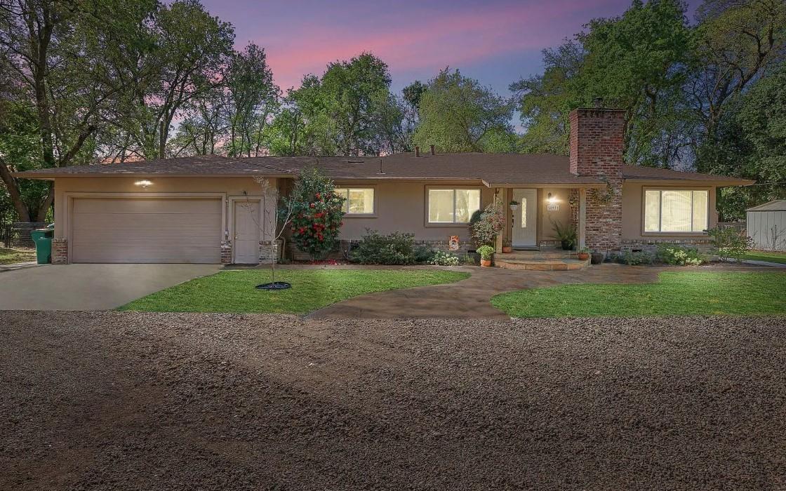 25931 Thornton Road Thornton, CA 95686 - Photo 2 of 31 a front view of a house with a yard and garage