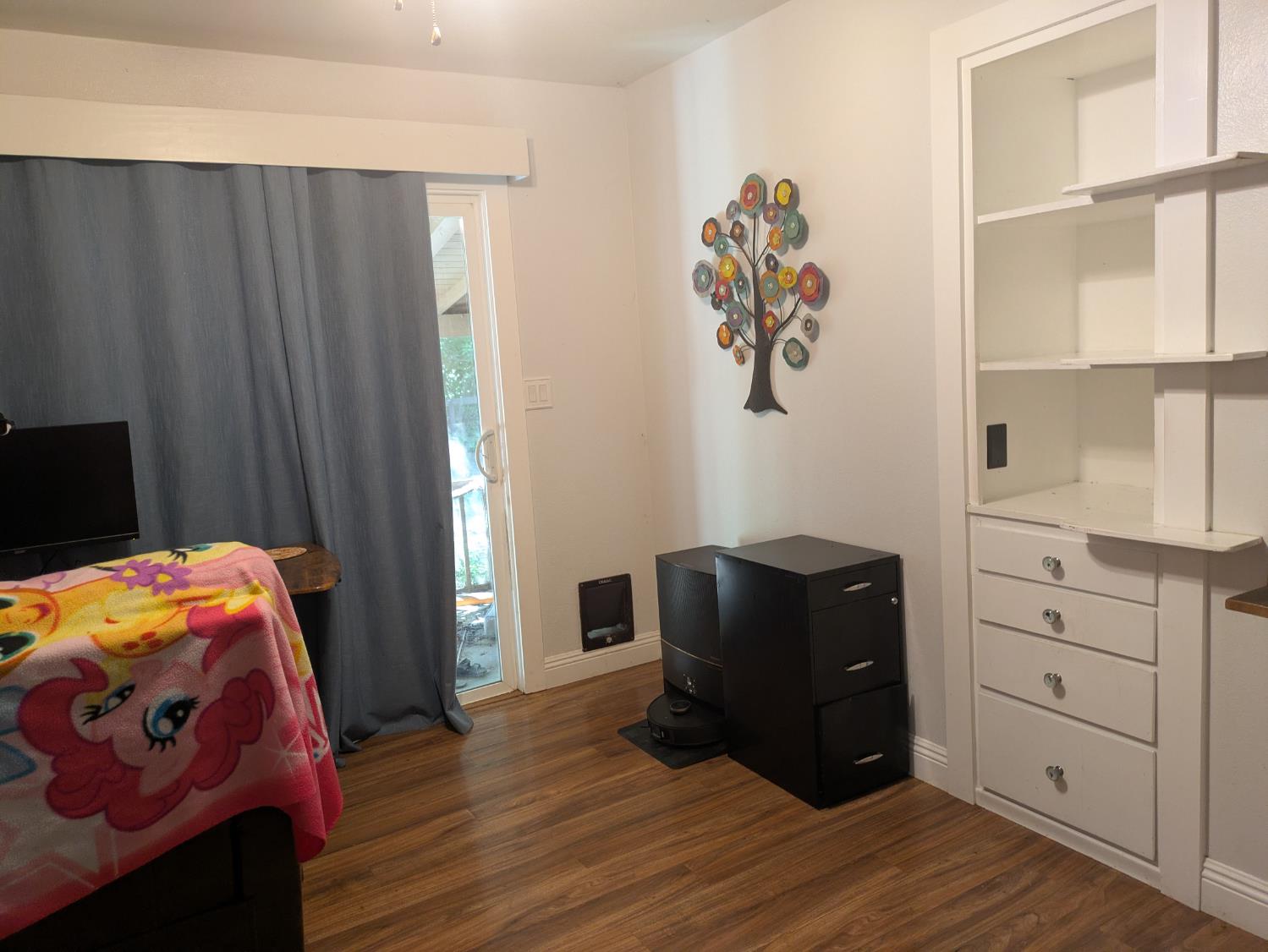 25931 Thornton Road Thornton, CA 95686 - Photo 21 of 31 a bedroom with a bed and wooden floor
