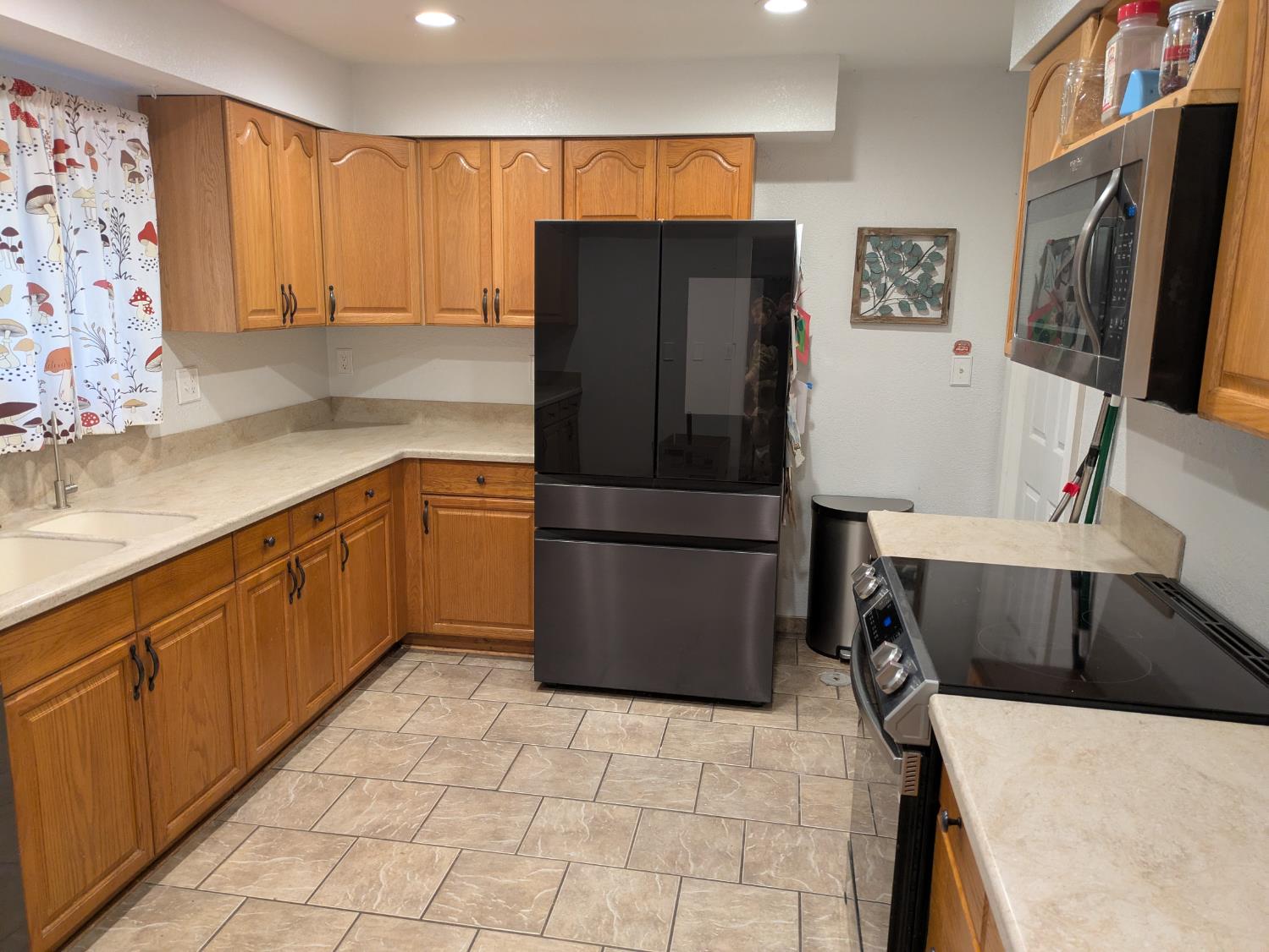 25931 Thornton Road Thornton, CA 95686 - Photo 9 of 31 a kitchen with stainless steel appliances a refrigerator sink and cabinets