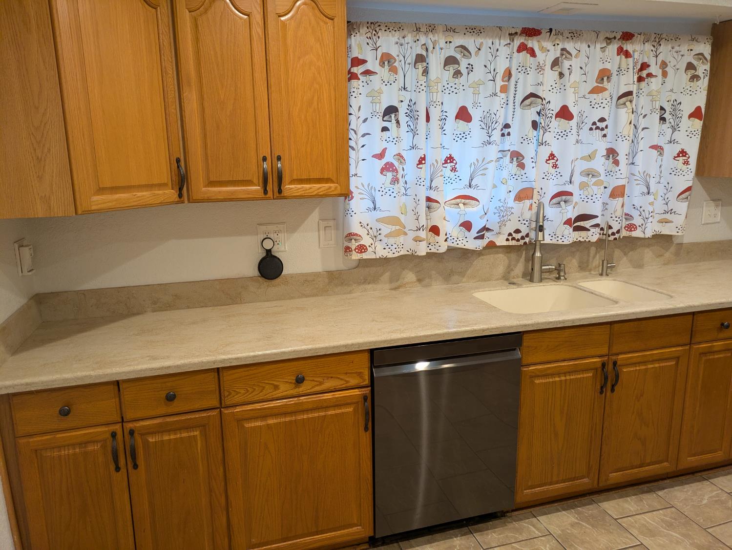 25931 Thornton Road Thornton, CA 95686 - Photo 10 of 31 a view of a kitchen with wooden cabinets and a sink
