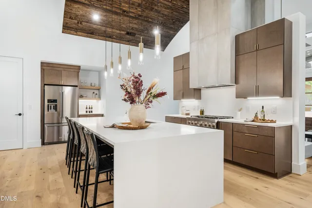 a view of a room with furniture and wooden floor