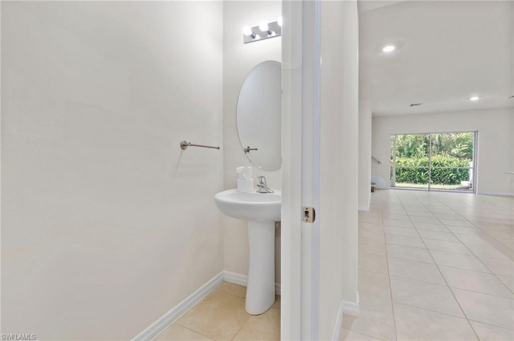 15535 Wildflower Circle Naples, FL 34119 - Photo 14 of 33 a bathroom with a sink